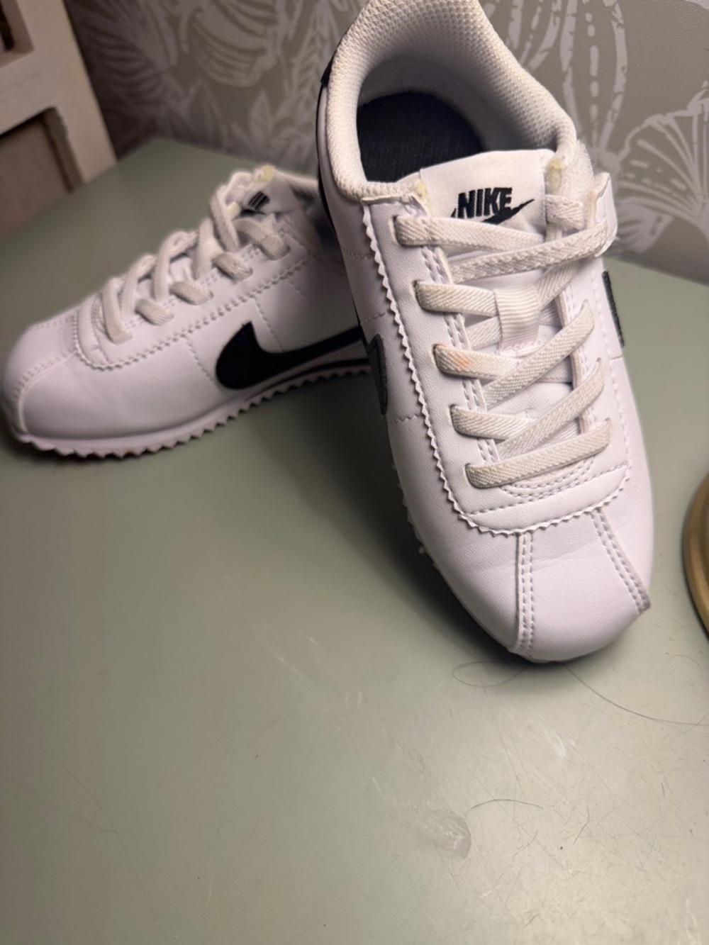 Nike Kids White Sneakers with Black Swoosh